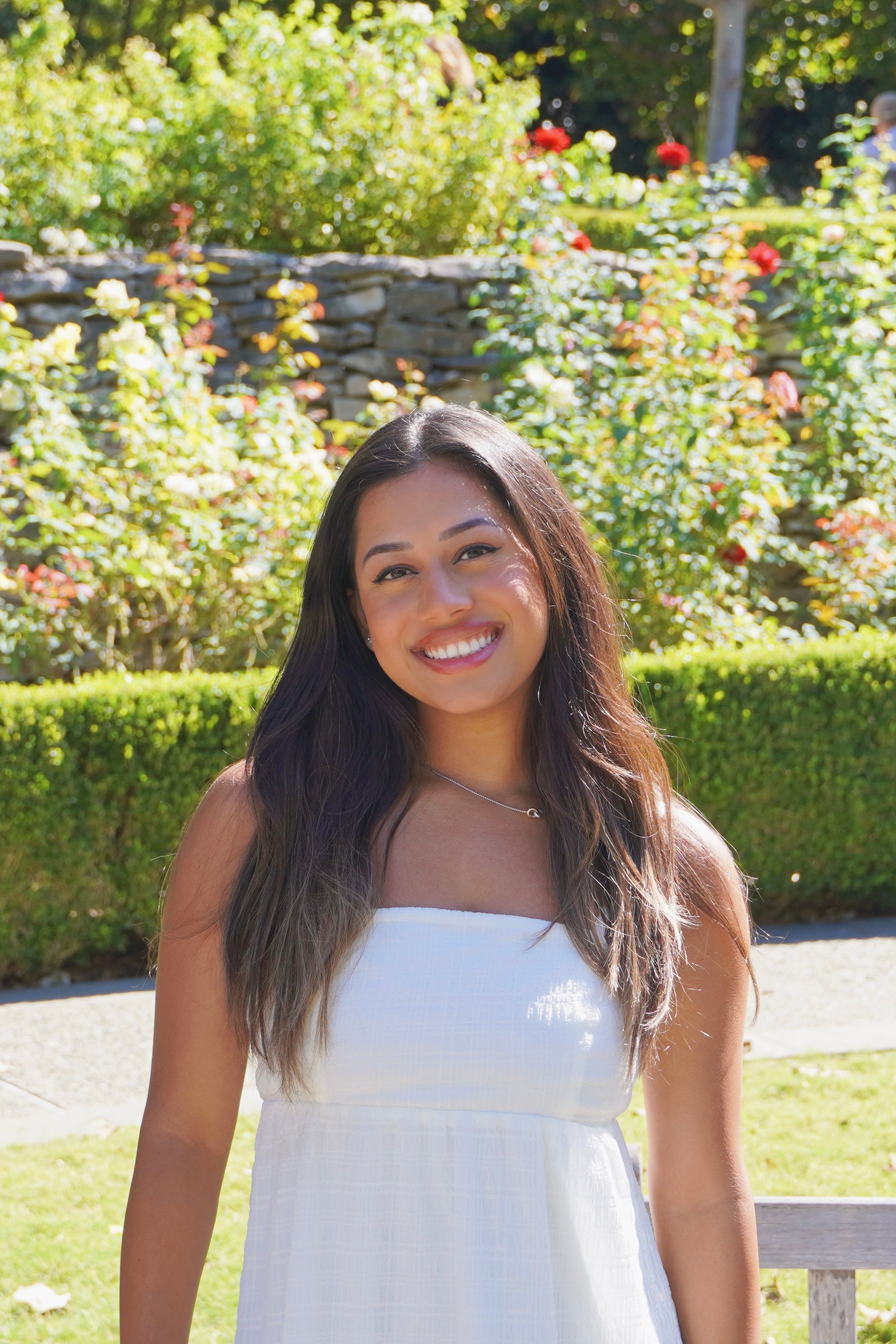 Sitasma smiling in a garden